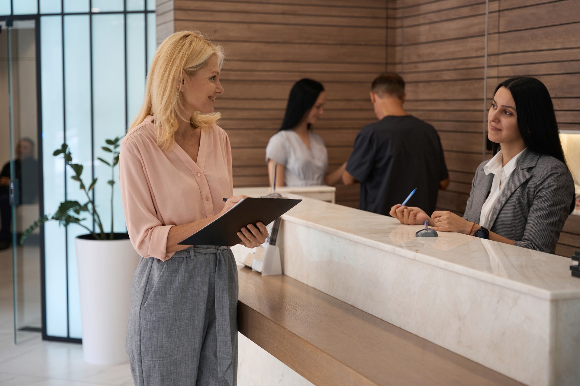 Adult woman standing by the reception zone